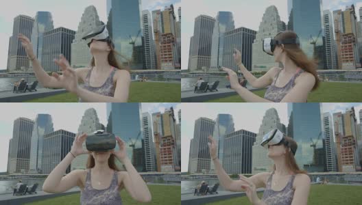 一名年轻女子戴着虚拟现实眼镜在纽约曼哈顿市中心高清在线视频素材下载