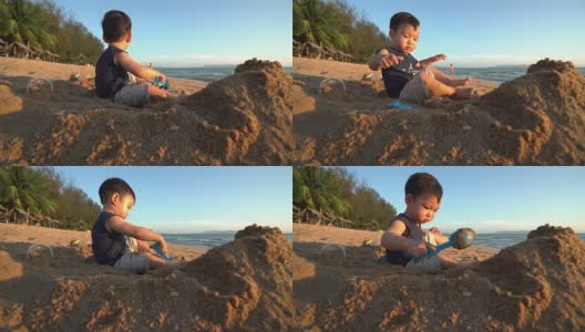 宝宝在沙滩上玩沙堡高清在线视频素材下载
