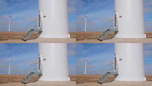带基塔的风力发电机高清在线视频素材下载