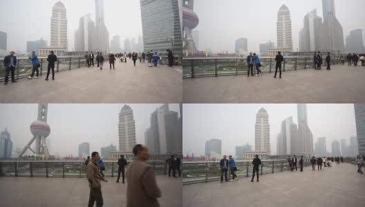 中国上海，2015年11月28日:中国上海，游客在著名的东方明珠电视塔附近漫步高清在线视频素材下载