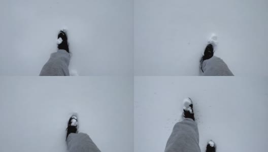 冬天穿登山靴的人走在雪地上，新雪上留下脚印。从眼睛看到的景色。广角视图。冬季户外活动。新年，圣诞节，4K高清在线视频素材下载