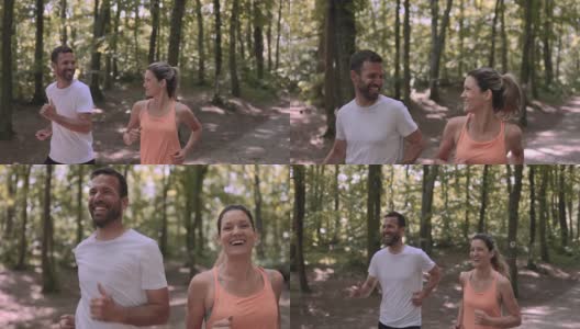 快乐的运动情侣一边在大自然中跑步一边聊天。高清在线视频素材下载
