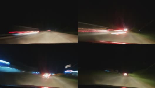 从挡风玻璃肮脏的车里看到的夜间印度高速公路的超短镜头。车里的视角。汽车留下轻轨。汽车在夜间的高速运动高清在线视频素材下载