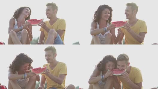 年轻夫妇在海滩上吃西瓜高清在线视频素材下载
