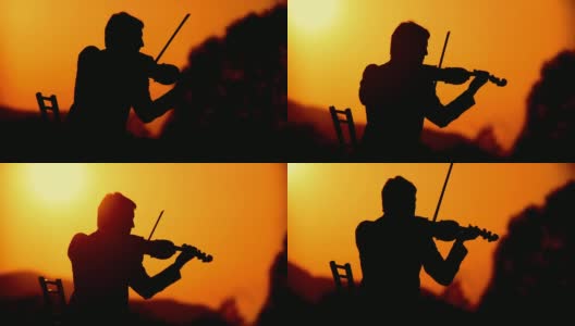 一个小提琴家在日落时的剪影高清在线视频素材下载