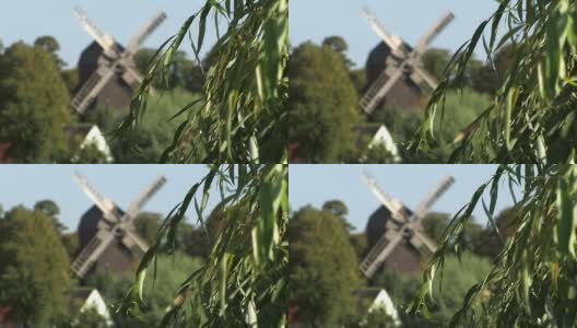 村庄附近的风车高清在线视频素材下载