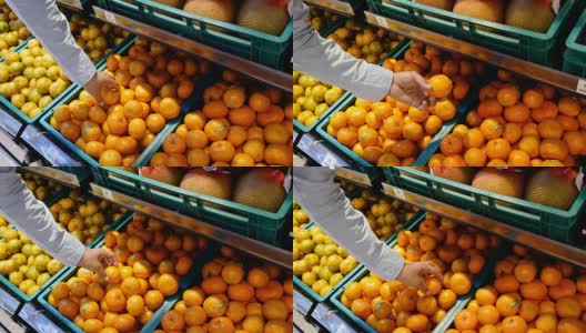 男人在超市挑选橘子高清在线视频素材下载