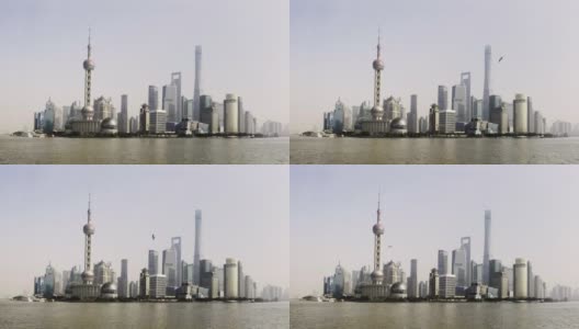 在上海的天际线上，货船和船只在黄浦江上穿梭高清在线视频素材下载