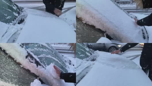 男人在给她的车清理积雪。高清在线视频素材下载