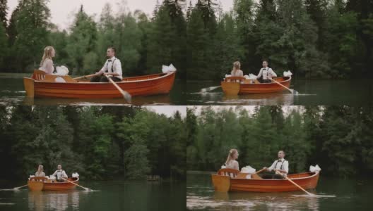 SLO MO新娘和新郎在湖上划船高清在线视频素材下载