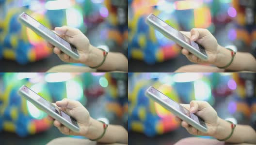 一名女子在百货商店使用智能手机高清在线视频素材下载