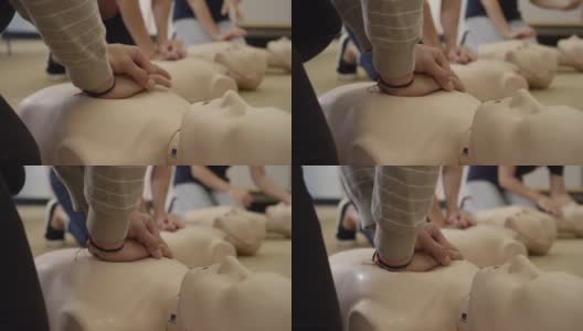 近距离练习胸部按压假人在EMT急救训练高清在线视频素材下载