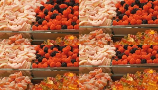 市场柜台上各种各样的糖果高清在线视频素材下载