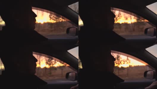 一个成年男子在夕阳的映衬下开车。高清在线视频素材下载