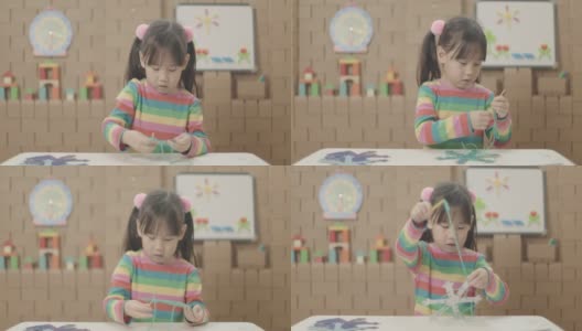 小女孩手工制作雪花工艺品供家庭教育使用高清在线视频素材下载