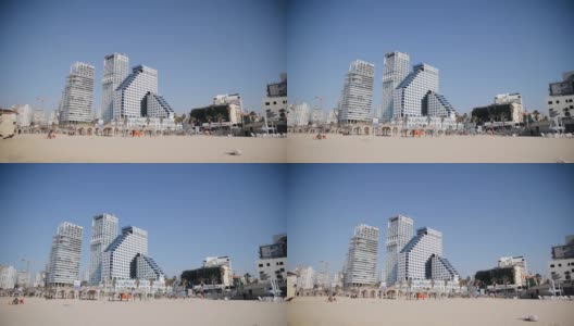 特拉维夫，以色列- 2022年1月26日:海滩线附近新摩天大楼的低角度视图。特拉维夫市在冬天的时候高清在线视频素材下载