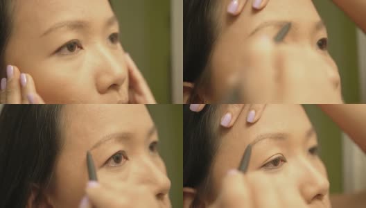 正在化妆的亚洲女性高清在线视频素材下载