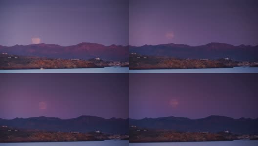 月亮在山上的海岸景色。间隔拍摄高清在线视频素材下载