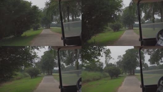 高尔夫球车一种高尔夫球车在通往下一洞的车道上行驶高清在线视频素材下载