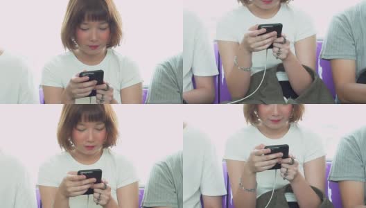 亚洲女性在火车上使用智能手机高清在线视频素材下载