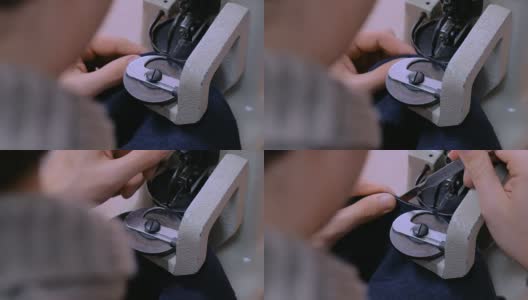 斯金纳在工作室使用缝纫机缝制毛皮高清在线视频素材下载