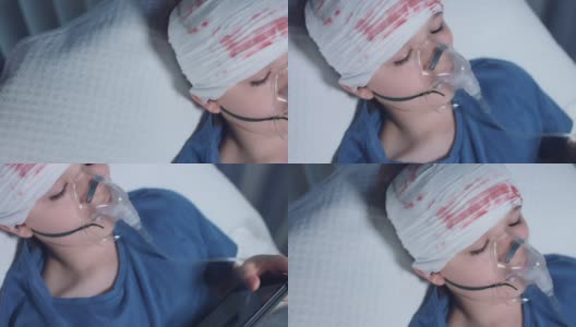 一个生病的孩子带着氧气面罩在平板电脑上玩的4k医院照片高清在线视频素材下载