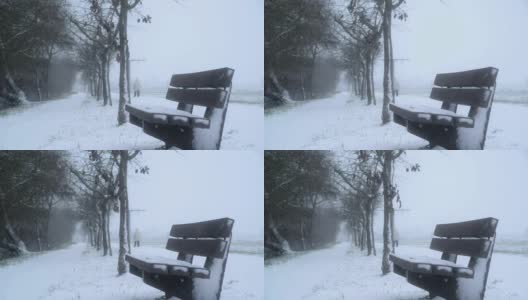 冬天，公园里铺满雪的木凳高清在线视频素材下载