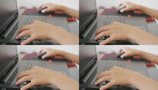 青少年使用笔记本电脑。少年手按笔记本键盘的特写。高清在线视频素材下载