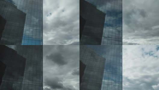 在玻璃摩天大楼中移动和反射的云的时间间隔高清在线视频素材下载