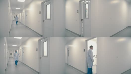 医院的工作人员穿过走廊进入一间病房高清在线视频素材下载