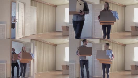 搬家那天，一对夫妇把箱子搬进新家高清在线视频素材下载
