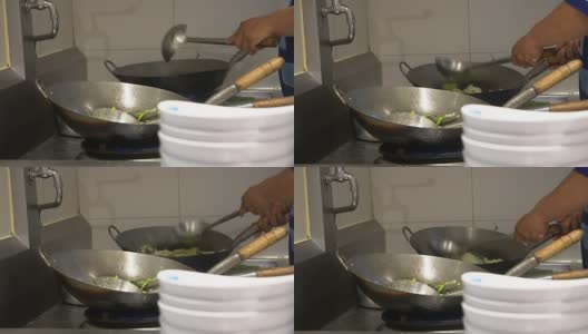 厨师在火上用平底锅做饭高清在线视频素材下载