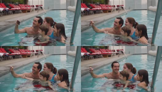 幸福的家庭在游泳池用智能手机自拍了一天高清在线视频素材下载