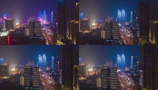 夜光显示飞行在青岛市区，交通，街道，道路航拍时间的全景4k中国高清在线视频素材下载