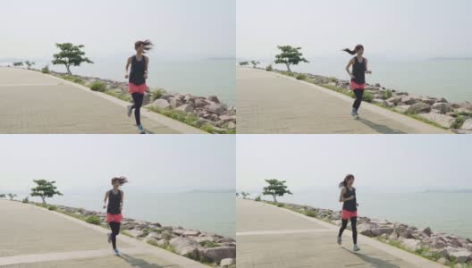 年轻的亚洲女人在户外跑步高清在线视频素材下载
