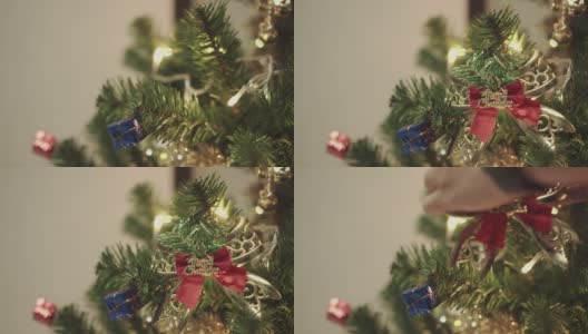 女人双手挂在松树上，装饰圣诞快乐高清在线视频素材下载