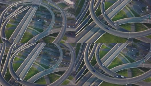 晴天，中国大城市成都高架路和交通枢纽的上下角无人机视图。现代建筑设计的交通方式避免了交通堵塞，车辆很多高清在线视频素材下载