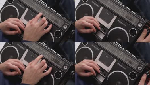 男性旋转旧收音机旋钮，触摸仪表板上的刻度。调优高清在线视频素材下载