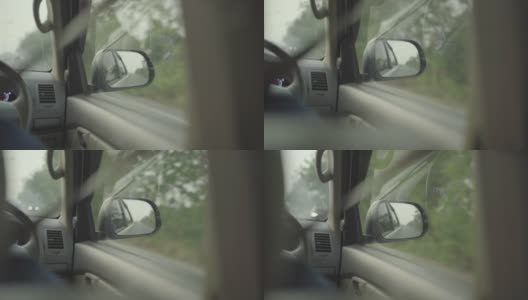 一个女人开车的后视图。高清在线视频素材下载