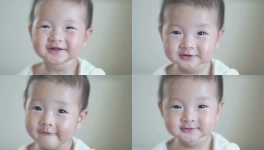 特写快乐微笑亚洲可爱的宝贝女孩，宝宝积极的情绪，快乐的时间概念高清在线视频素材下载