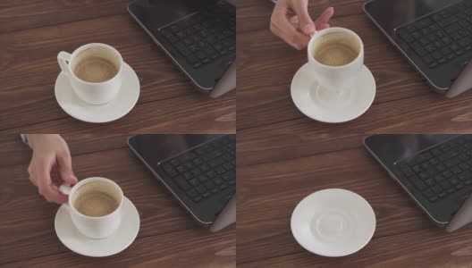 一个女人在家里用电脑工作，喝咖啡。一台笔记本电脑，一杯加酱的白咖啡高清在线视频素材下载