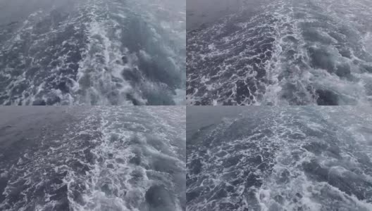 船在海洋里。海浪从渡船的后面掠过水面。有泡沫痕迹的船背景与波。大自然。高清在线视频素材下载