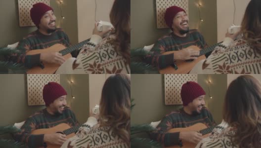 潮男在家给女友弹吉他高清在线视频素材下载