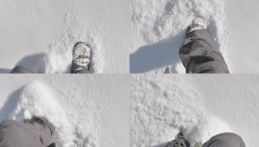 这是一个阳光明媚的日子里在雪地里行走的特写镜头。高清在线视频素材下载