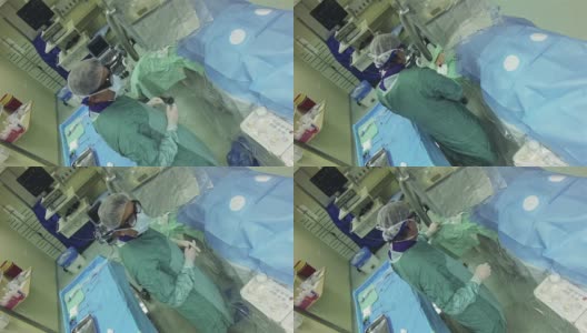 医生穿着防护服在手术室给病人动手术高清在线视频素材下载