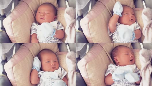 亚洲新生婴儿在婴儿车高清在线视频素材下载