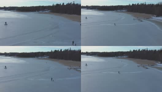 令人敬畏的无人机拍摄的人们在冰冻的海面上行走。高清在线视频素材下载