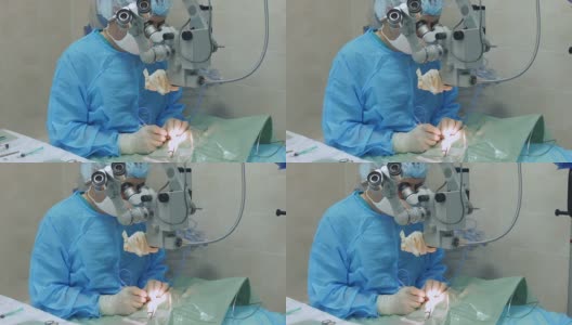显微外科医生通过显微镜操作眼睛高清在线视频素材下载