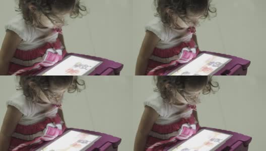 小女孩在玩电子平板电脑高清在线视频素材下载