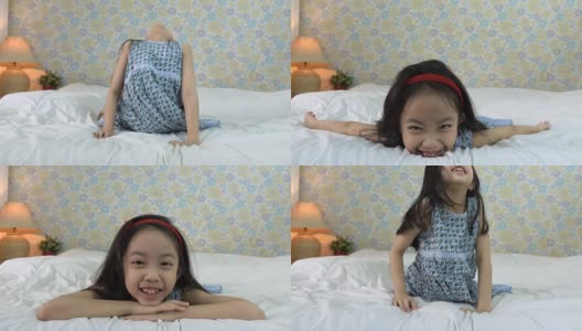 小女孩在床上做瑜伽高清在线视频素材下载